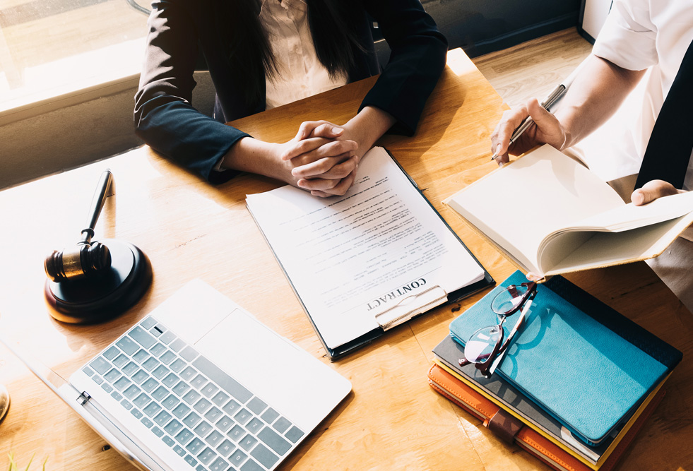 Judge gavel and scales of justice and book background